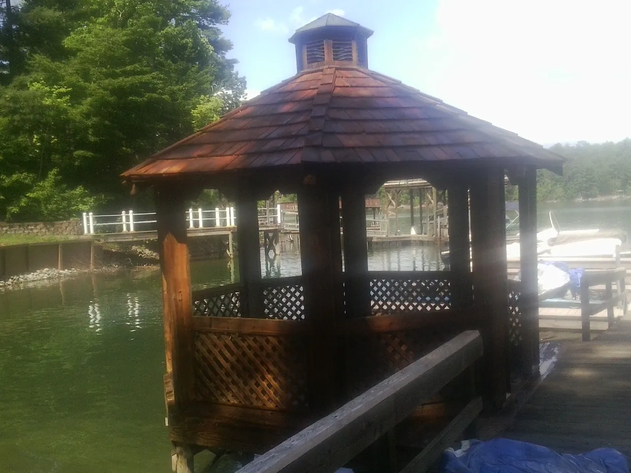 Cedar shake gazebo roof rebuilt on a lake dock in Clare